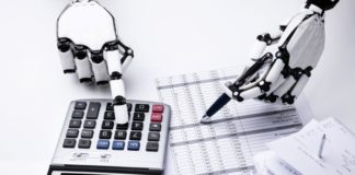 Robot hands working with a calculator and spreadsheet on payments.